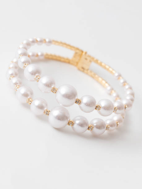 istock Gold bracelet isolated white background 1956804685