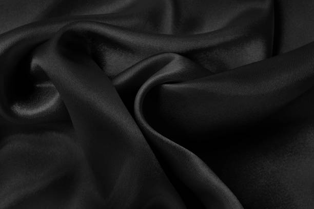 istock Black fabric cloth texture for background and design art work, beautiful crumpled pattern of silk or linen. 1956806823
