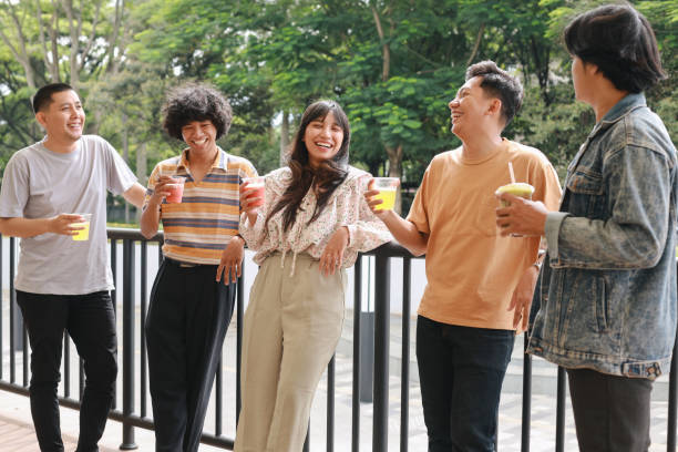 istock Diverse People Enjoying Healthy Juice Drinks at The Park 1956807407
