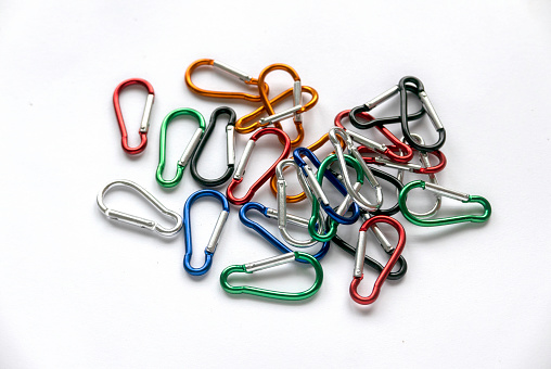 multicolor stainless steel construction carabiner isolated on white background.