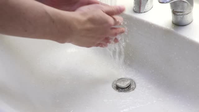 wash both hands in the washbasin