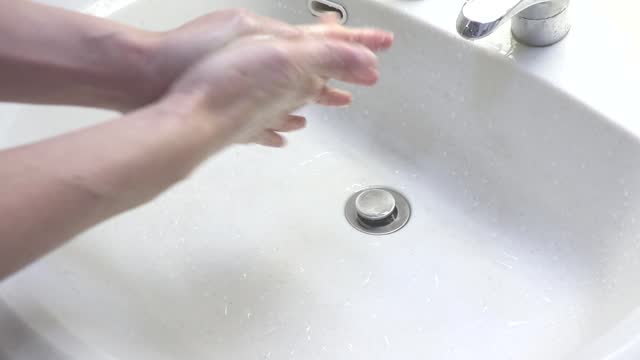 wash both hands thoroughly with soap
