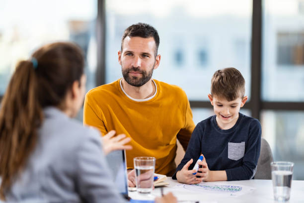 istock Single father and his son having a counseling session. 1956839641