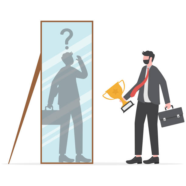 istock imposter syndrome, businessman looking shadow himself through mirror for Anxiety and lack of self confidence at work vector 1956883947