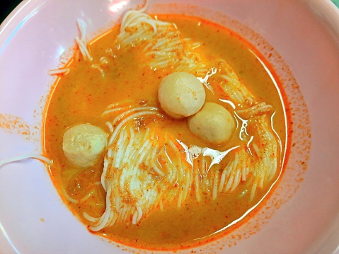 Rice Noodle in Curry Soup with Fish meatballs - Bangkok Street Food.