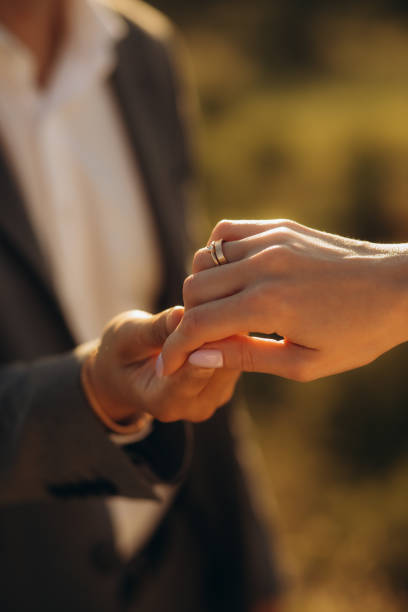 istock wedding theme, holding hands newlyweds 1956913995