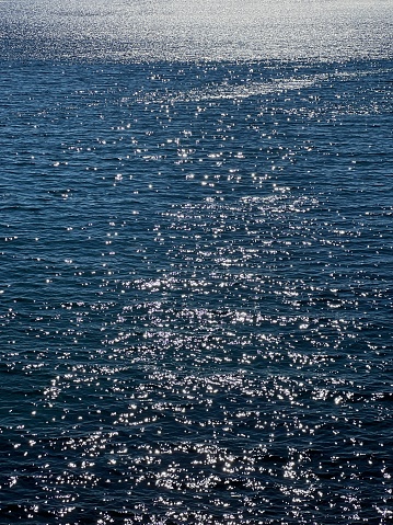 Blue glittering sea water surface