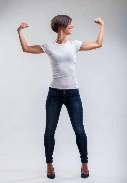 istock Empowered stance, celebrating physical strength with joy 1956926924