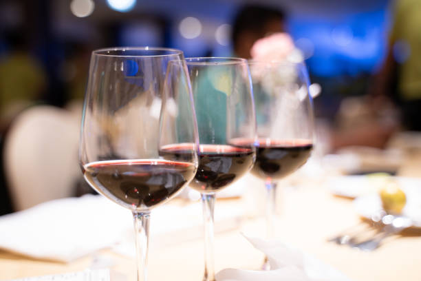 istock Wine glasses on the luxury dining table in the hotel 1956940113