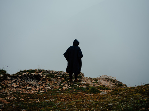 lonely man mountains fog nature fresh air landscape. High quality photo