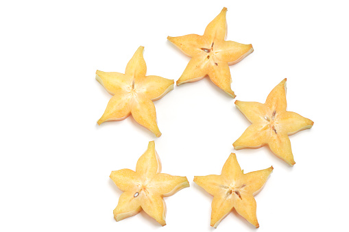 Sliced fresh organic star fruit delicious top view isolated on white background clipping path