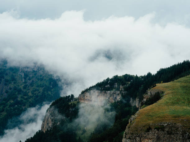mountains clouds travel extreme vacation. High quality photo