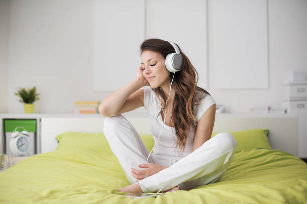 istock Cheerful girl relaxing at home 1956990083