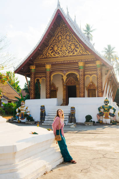 istock Woman exploring buddhist temple in Laos 1957023496