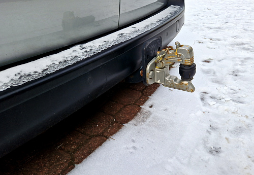 towing device mounted on the rear of the car. lunette carriage hook. the compressor or tow can be towed by car. snow, winter, bumper, tow bar, towbar, rear