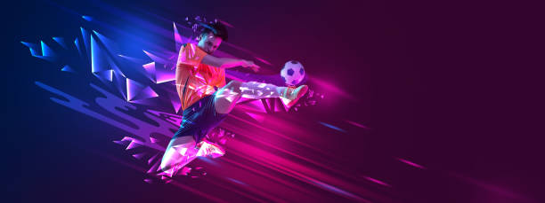 istock Young guy, soccer payer kicking ball in a jump over gradient background with polygonal and fluid neon elements. 1957058509