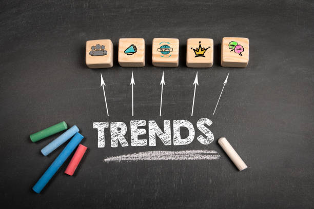 TRENDS Concept. Wooden blocks on a dark chalkboard background