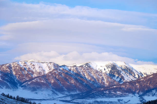 istock Cold snowy mountain landscape at sunset. 1957088158