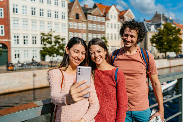 istock Three Young Friends Taking Selfies In Copenhagen In Denmark 1957089254