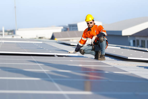 istock Engineer installing solar panels on roof top. 1957090315