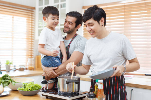 istock LGBTQ couple with adopted child. 1957090917