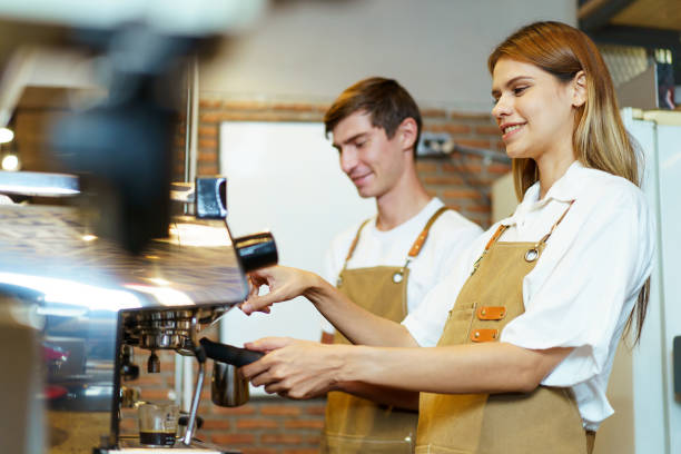 istock Barista working in coffee shop. 1957095911