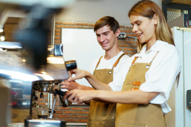 istock Barista working in coffee shop. 1957095912