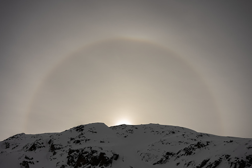 Halo efect an optical phenomenon. French alps in winter,  Rhone Alpes in France Europe. Les deux alpes Snowy alps mountains in Europe.