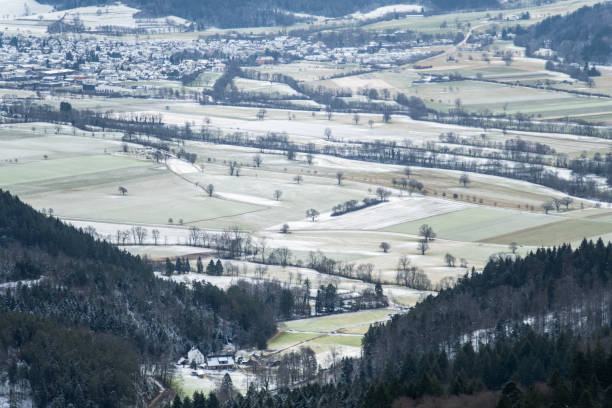 istock aerial view of the fields covered with snow surrounded with mountains 1957157707