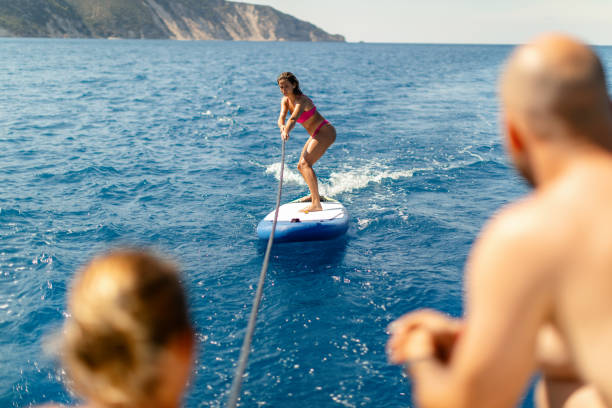 istock Woman surfing on a paddleboard 1957163826