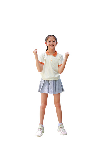 Happy Asian girl winner raise fists smile gesture isolated on white background. Image full length with Clipping path.