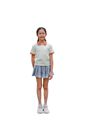 Asian child in school uniform with pink school bag on white background isolated