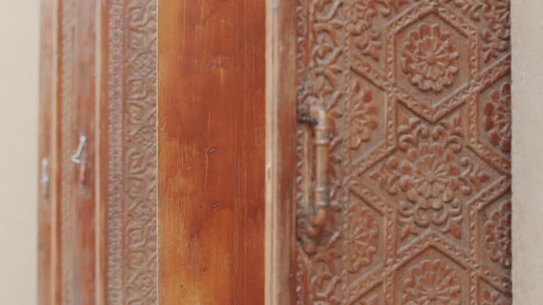 Wooden door with beautiful patterns. Close-up of carved wood. Antique door. 4K.