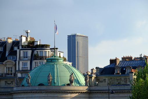 Paris, France - April 14, 2021: A view of the parisian roof and the Dome of the \