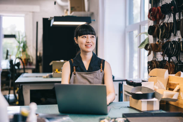 istock Japanese leathercraft studio owner works with a laptop 1957213629