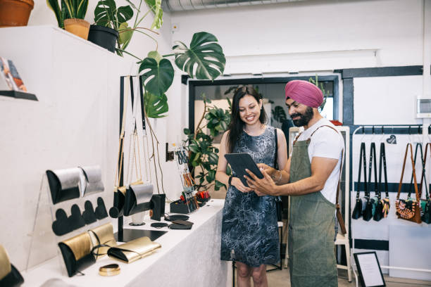 istock Female customer and Indian boutique owner having a friendly chat 1957214194