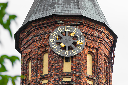Clock tower of Konigsberg Cathedral. Brick Gothic-style monument in Kaliningrad, Russia.