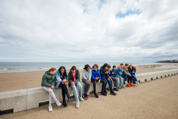 istock Teens Gathered by the Coast 1957234173