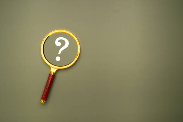istock A magnifying glass with a white question mark on a green background. 1957239244