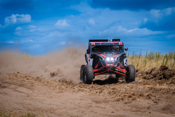 istock UTV buggy and 4x4 offroad in sandy track. Rally extreme riding 1957244756