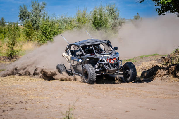 istock UTV vehicle offroad kicking up sand on dune. Extreme, adrenalin. 4x4. 1957244763