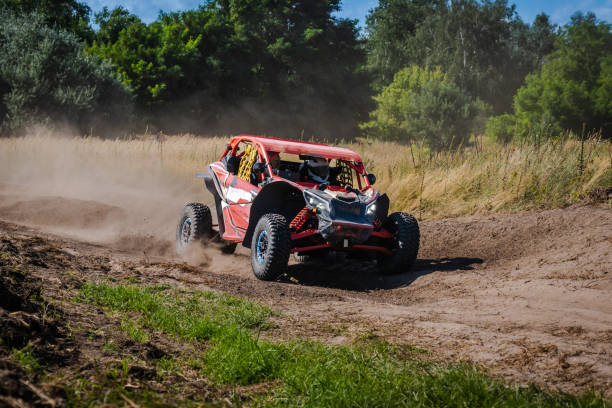 istock ATV and UTV riding in sandy dusty track. Amateur competitions. 4x4. 1957244764