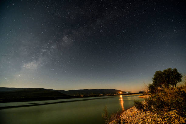 istock night sky with stars and clouds, starry night sky 1957247045