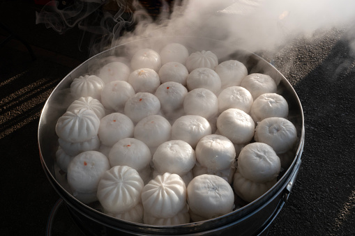 Variety of Chinese dim sum in bamboo steamers