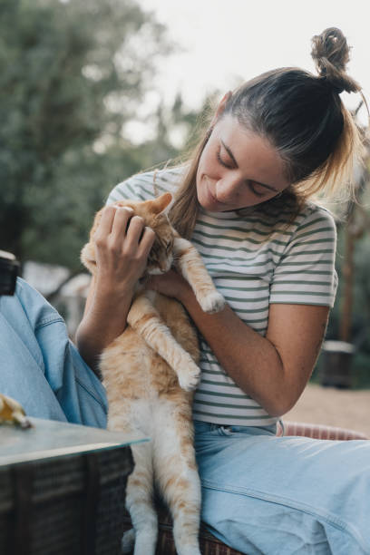 istock Blonde girl hugging a cat 1957250933
