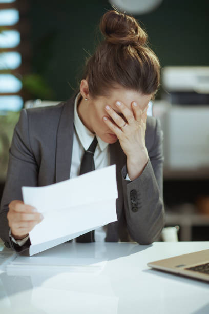 istock sad modern woman worker in modern green office 1957258584