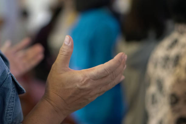 istock Hands Raising Worshipper Together. 1957313249