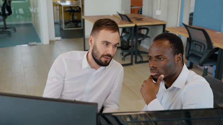 Two stock traders working in the office with exchange technology