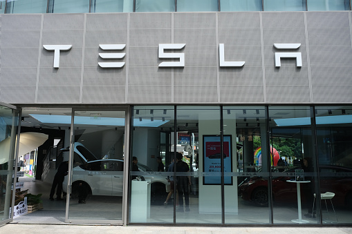Shanghai,China-May 20th 2023: Tesla electric car retail store with people