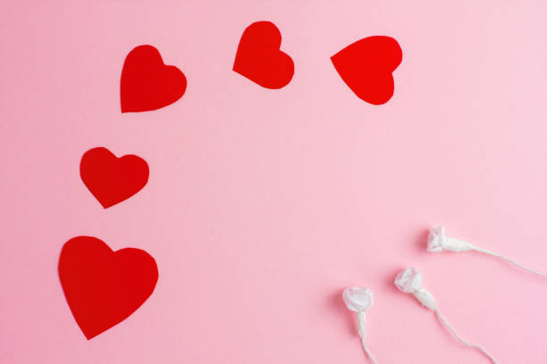 istock Red hearts with white roses on pink background. 1957405491